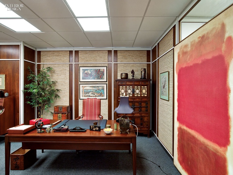 A mid-century executive office with Japanese or Japanese-inspired design elements including prints, furniture, accessories